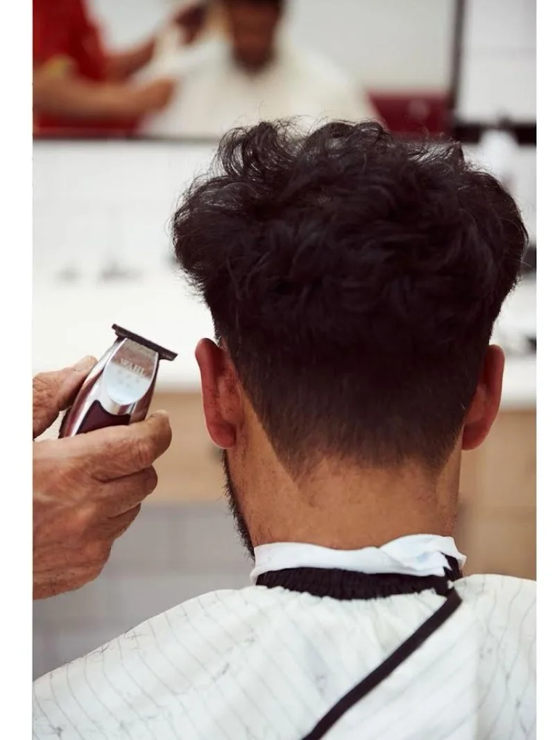 Wahl clippers detailing the back of a client's neck